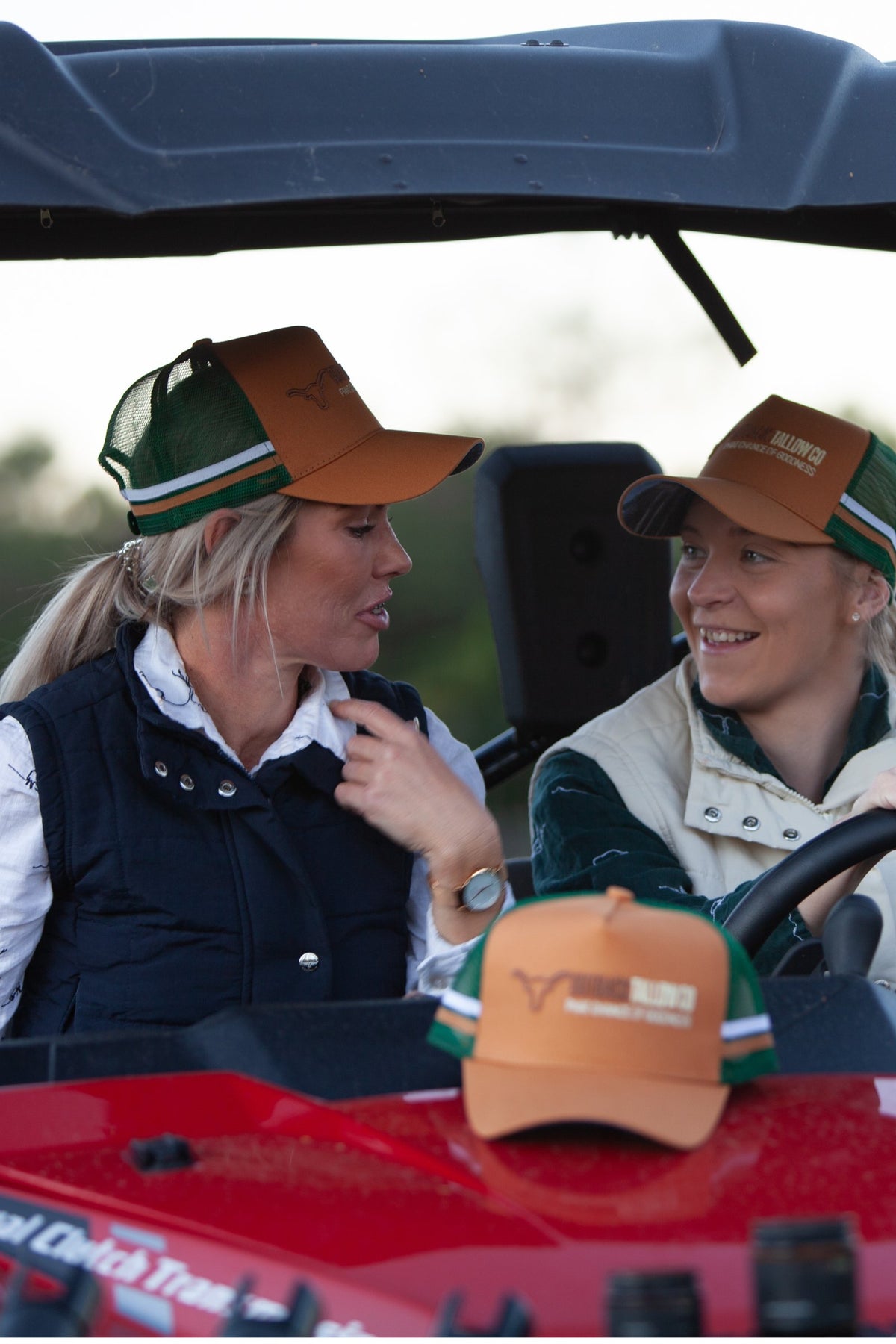 Kylie, founder of Outback Tallow Co, and her friend Kimmy in Outback Tallow Co caps