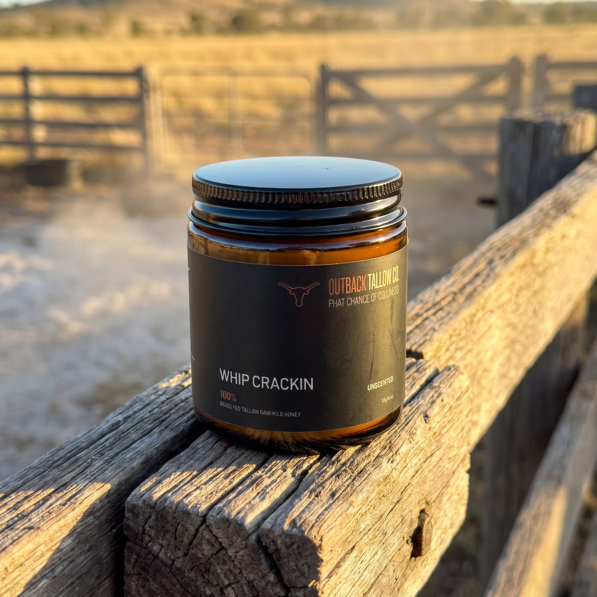 Whip Crackin' jar on a timber rail at the cattle yards at sunrise (AI-generated image)