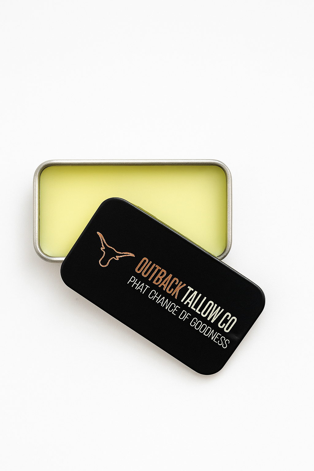 THE OG pocket balm tin tilted showing tallow balm texture