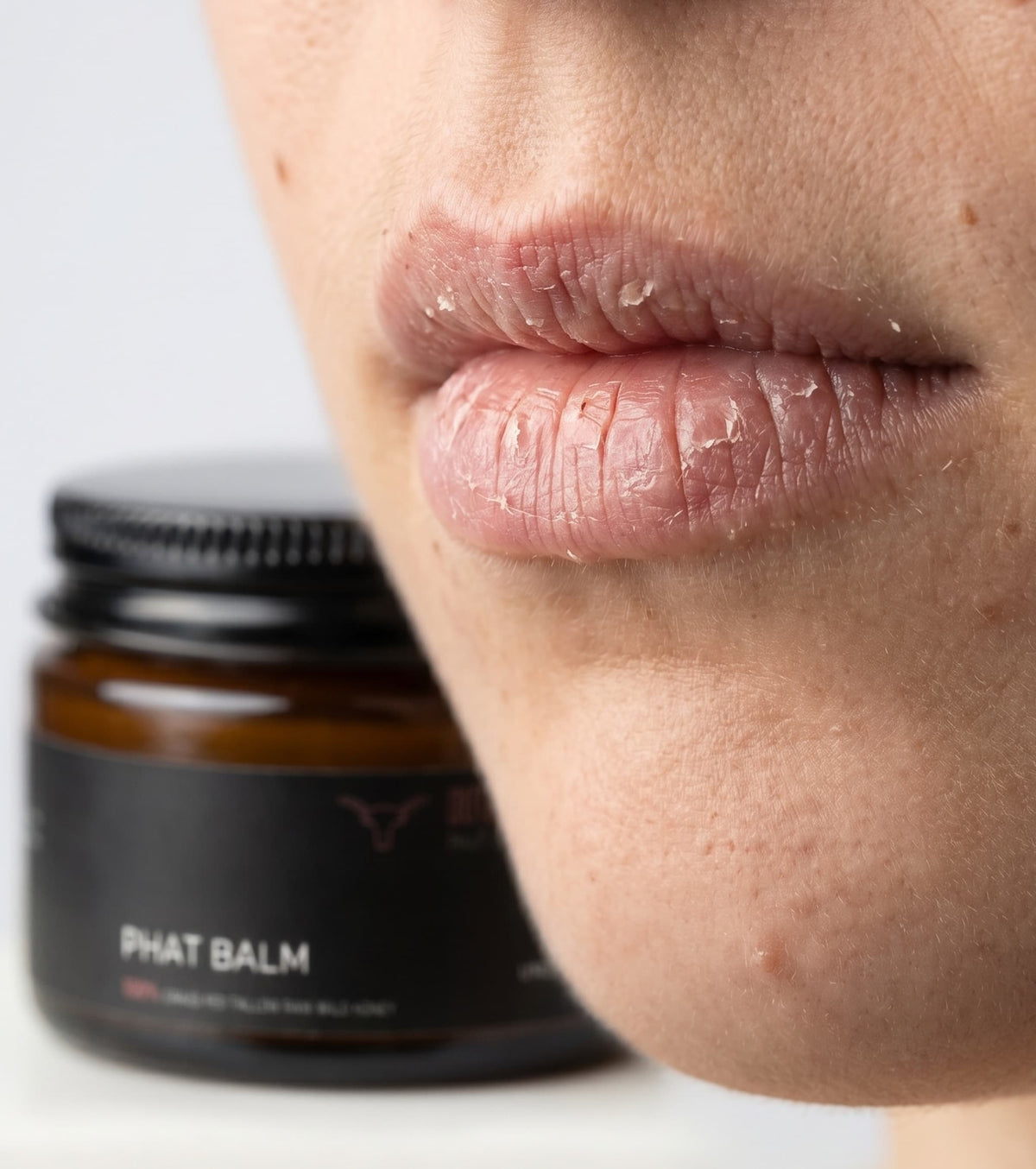 Woman applying PHAT BALM grass fed beef tallow balm to skin concentrated natural skincare for dry cracked stressed eczema and psoriasis prone skin no synthetic fragrance fast dispatch Australia wide free shipping over $100 Outback Tallow Co Townsville Queensland Australia