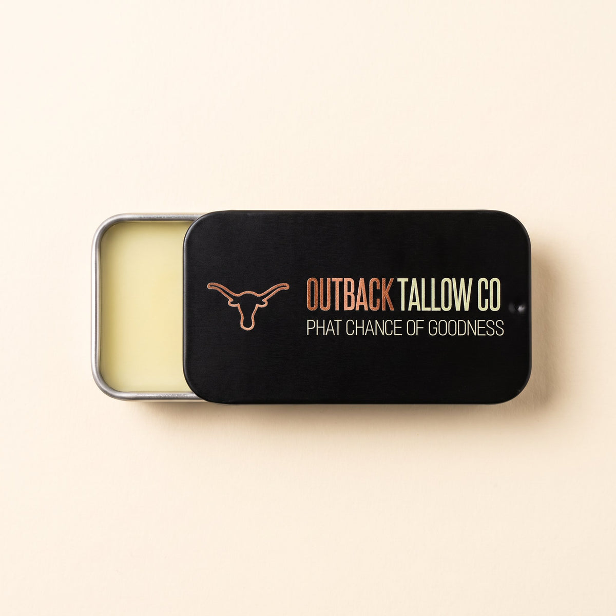 The OG 10g beef tallow balm slide tin by Outback Tallow Co, slid open to show the balm (AI-generated image)