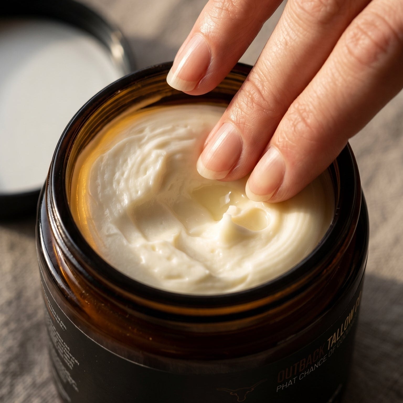 Whip Crackin whipped grass fed beef tallow balm texture closeup finger scooping balm for dry sensitive eczema and psoriasis prone skin natural skincare no synthetic fragrance fast dispatch free shipping over $100 Outback Tallow Co Townsville Queensland Australia
