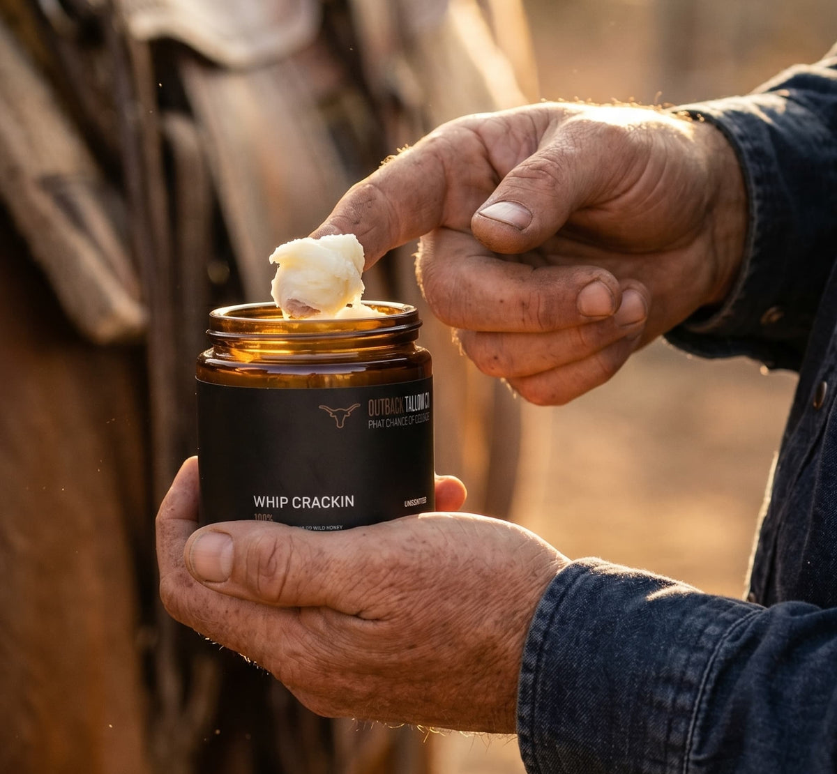 Applying Whip Crackin whipped beef tallow balm outdoors