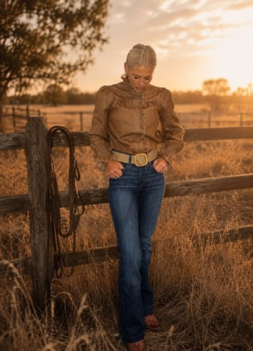Kylie leaning on a timber fence in the warm afternoon sun in north Queensland
