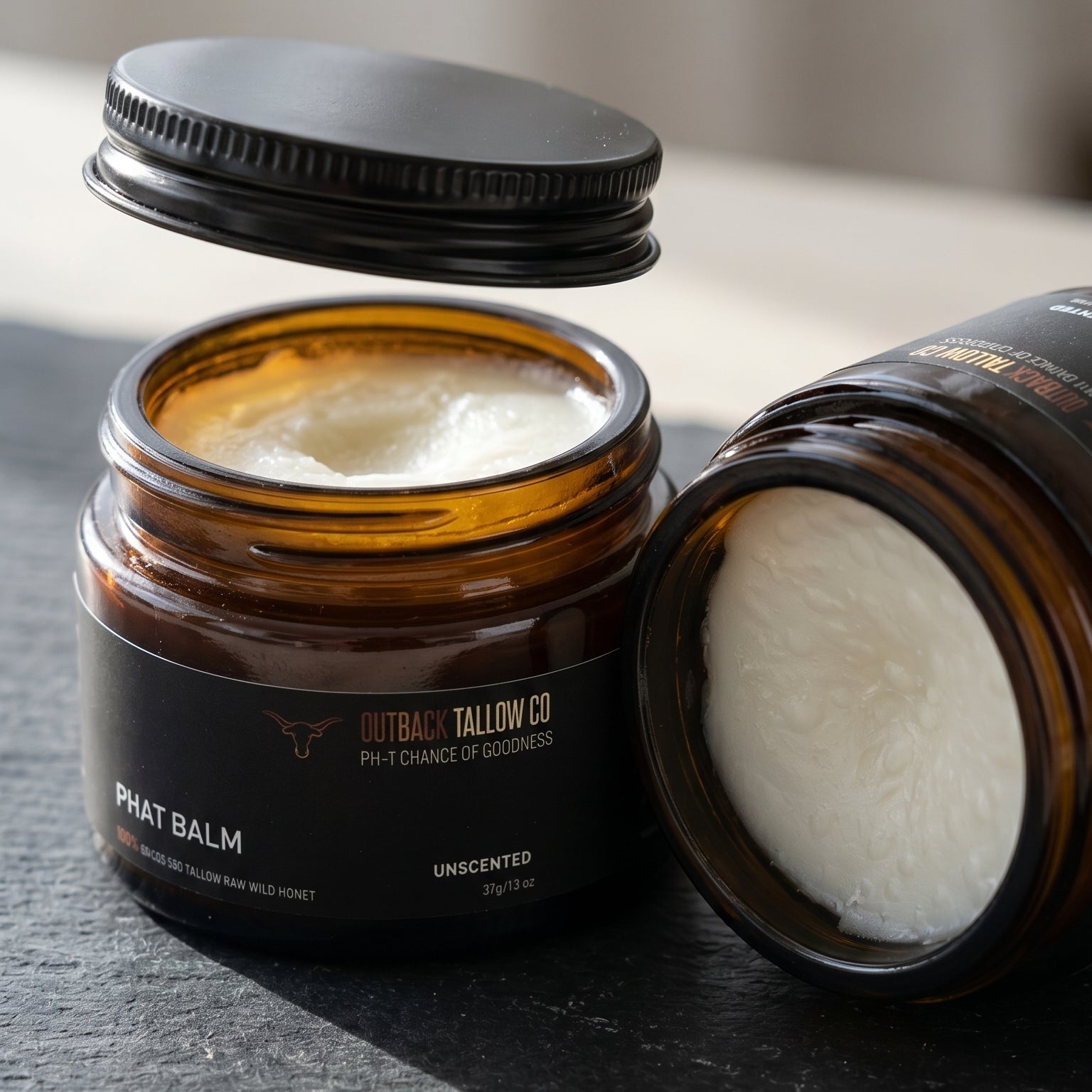 PHAT BALM grass fed beef tallow balm for dry cracked skin two jars one open showing firm balm texture natural skincare eczema psoriasis sensitive skin no synthetic fragrance fast dispatch Australia wide free shipping over $100 Outback Tallow Co Townsville Queensland Australia