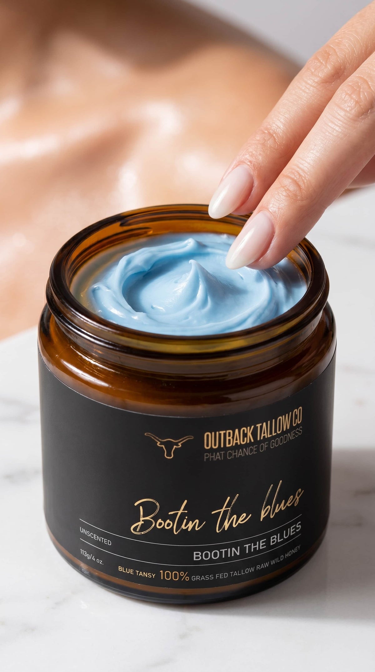 Bootin the Blues whipped blue tansy grass-fed beef tallow balm texture closeup finger scooping balm for sensitive skin eczema psoriasis and rosacea showing blue colour and whipped consistency – natural skincare no synthetic fragrance fast shipping Australia wide – Outback Tallow Co Townsville Queensland Australia