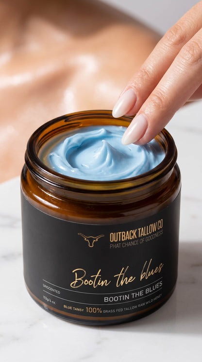 Bootin the Blues whipped blue tansy grass-fed beef tallow balm texture closeup finger scooping balm for sensitive skin eczema psoriasis and rosacea showing blue colour and whipped consistency – natural skincare no synthetic fragrance fast shipping Australia wide – Outback Tallow Co Townsville Queensland Australia